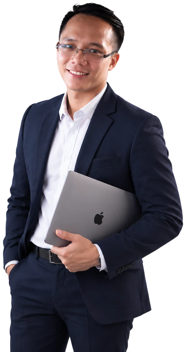 Kerry Gabalonos in a navy suit, holding a laptop